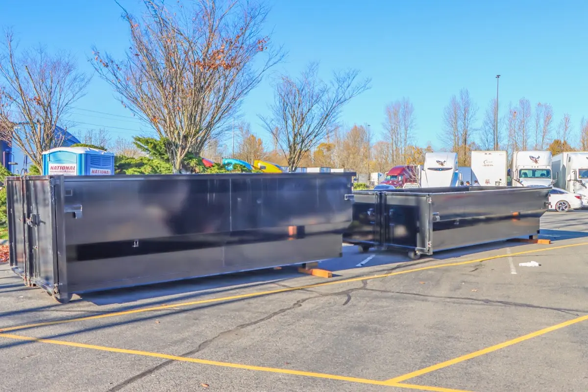 Professional dumpster rental service with roll-off container on residential driveway in Altamonte Springs